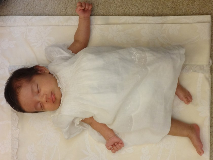 ABC in her baptism dress